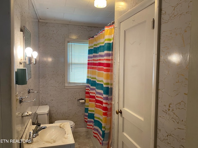 bathroom with toilet, tile flooring, and vanity