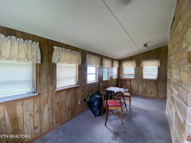 sunroom featuring vaulted ceiling