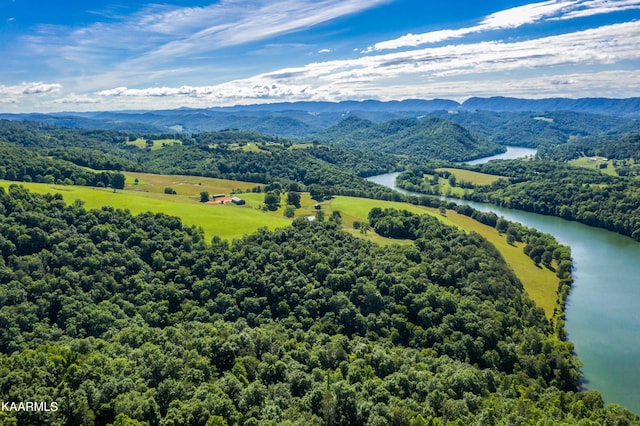 aerial view featuring a water and mountain view