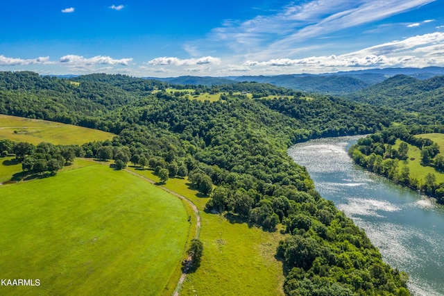 aerial view featuring a water and mountain view