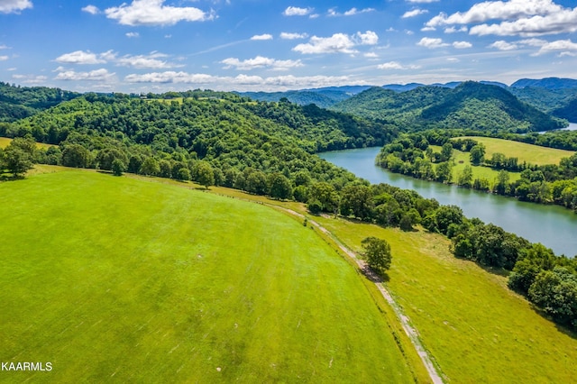 aerial view featuring a water and mountain view