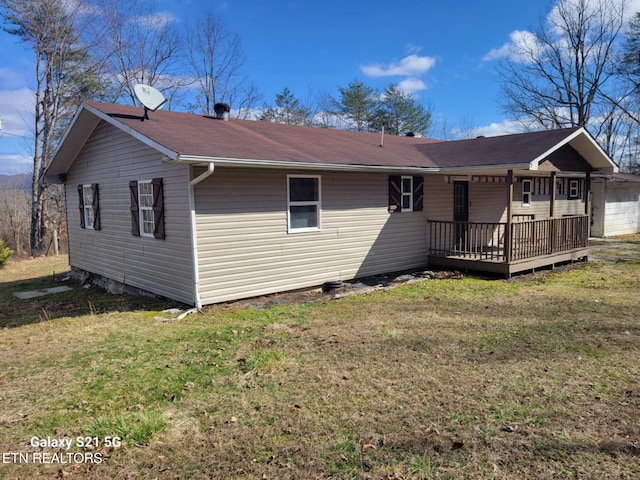1359 Ditney Trl, Pioneer, TN 37847 - rear view of house with a wooden deck and a lawn