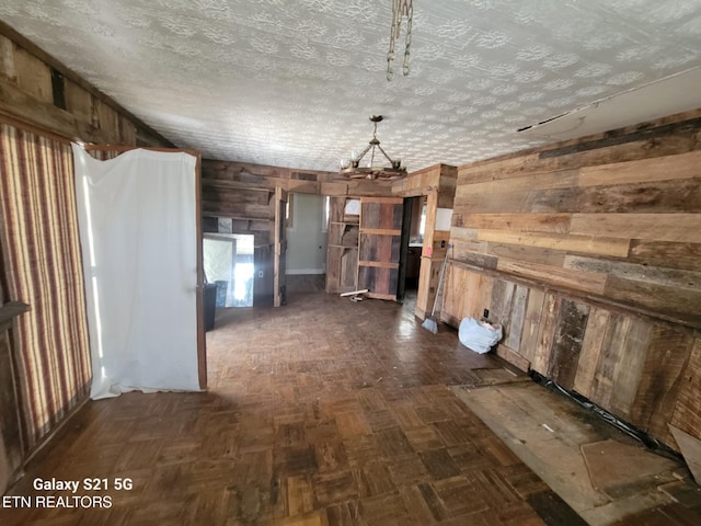 1359 Ditney Trl, Pioneer, TN 37847 - kitchen with wood walls and a chandelier