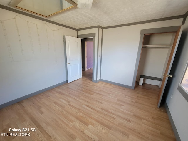1359 Ditney Trl, Pioneer, TN 37847 - unfurnished bedroom with ornamental molding, light wood-type flooring, and a closet