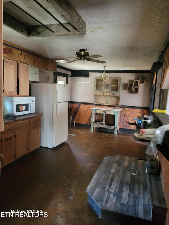 1359 Ditney Trl, Pioneer, TN 37847 - kitchen with white appliances, unfinished concrete floors, and a ceiling fan