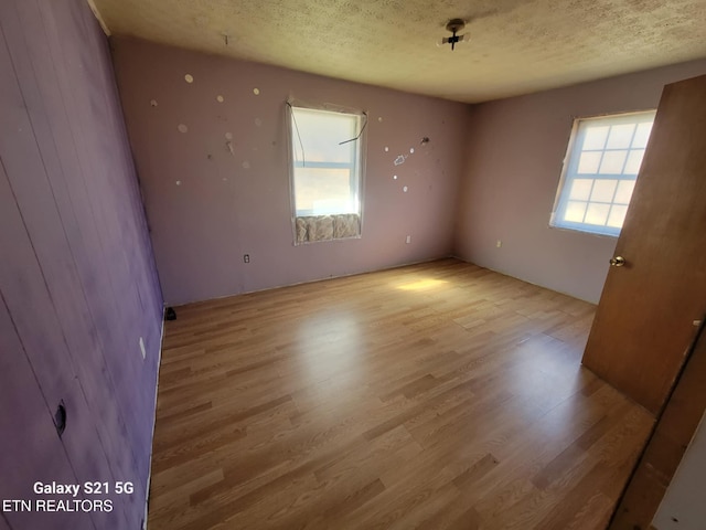 1359 Ditney Trl, Pioneer, TN 37847 - spare room featuring wood finished floors and a textured ceiling