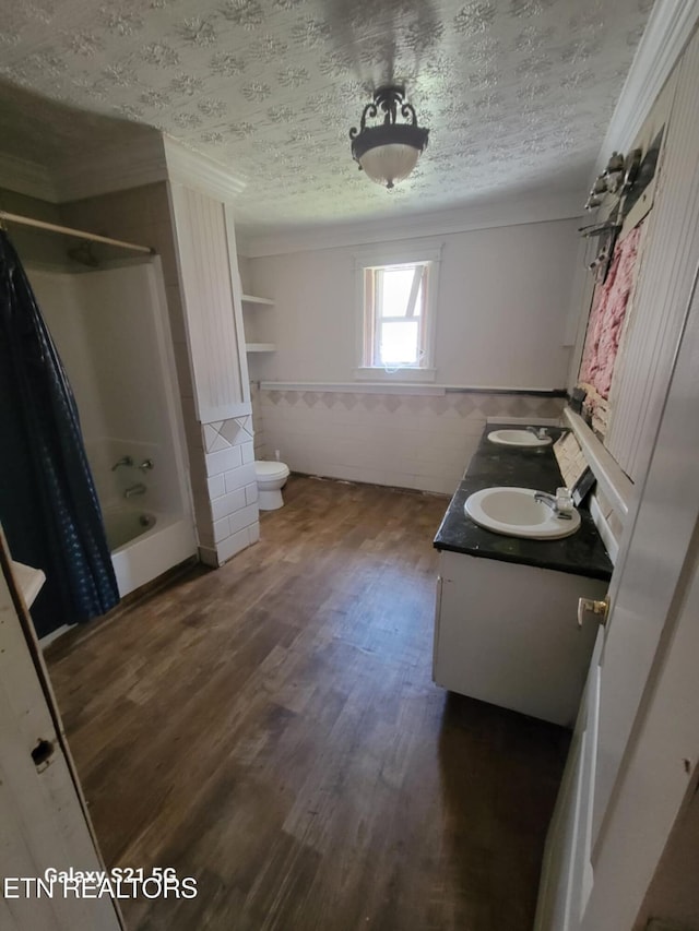 1359 Ditney Trl, Pioneer, TN 37847 - bathroom with wood finished floors, double vanity, tile walls, wainscoting, and shower / bath combo