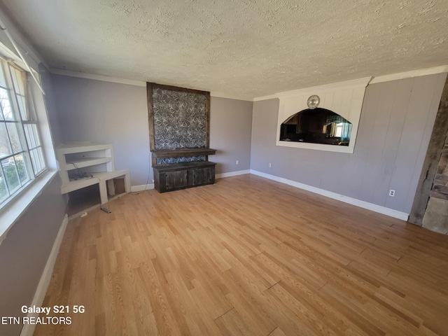 1359 Ditney Trl, Pioneer, TN 37847 - unfurnished living room with a textured ceiling and wood finished floors