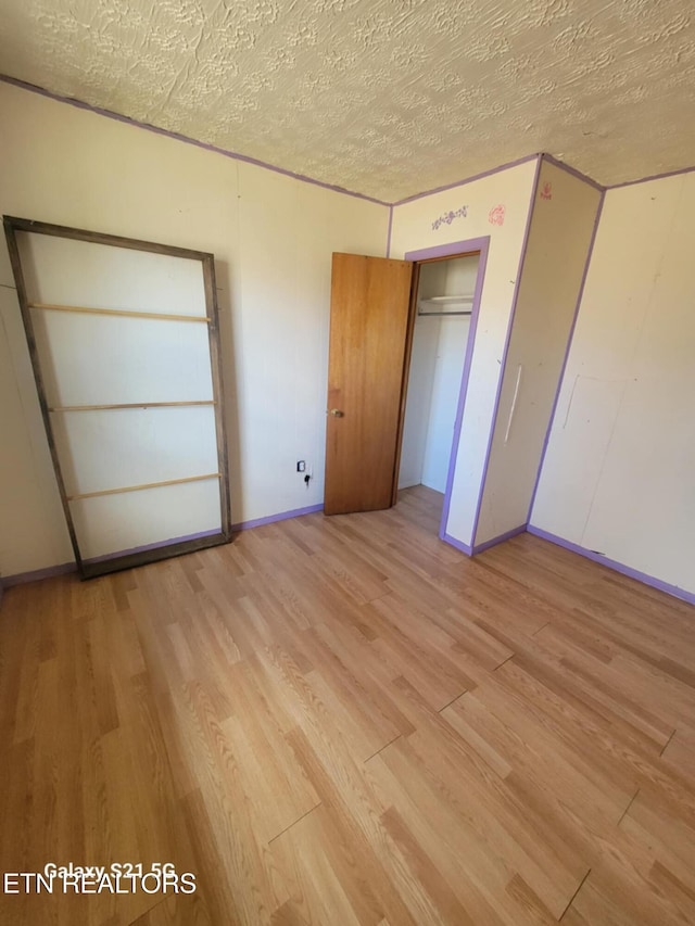 1359 Ditney Trl, Pioneer, TN 37847 - unfurnished bedroom featuring light wood-style floors and a textured ceiling