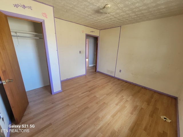 1359 Ditney Trl, Pioneer, TN 37847 - unfurnished bedroom featuring light wood finished floors and a closet