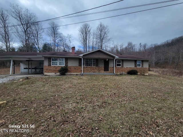 1359 Ditney Trl, Pioneer, TN 37847 - single story home with brick siding, a chimney, an attached carport, and a front lawn