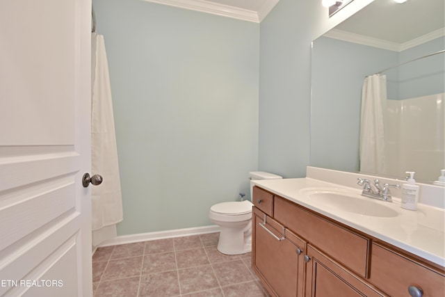 bathroom with vanity, toilet, ornamental molding, baseboards, and tile patterned floors