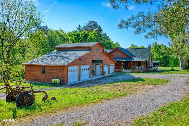 log home featuring covered porch