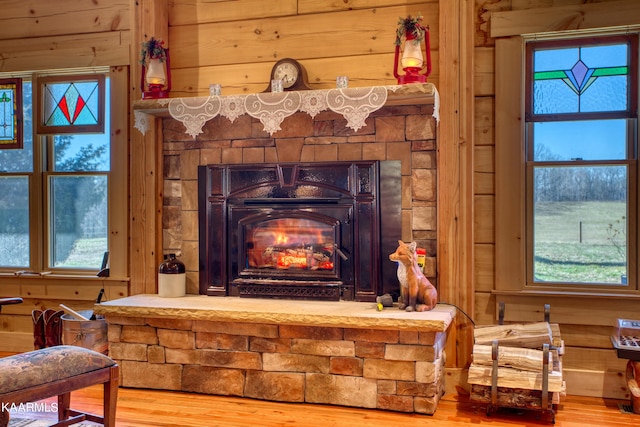 room details featuring hardwood / wood-style floors and wooden walls