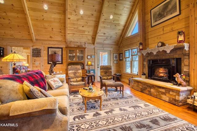 living room featuring wood walls and beam ceiling