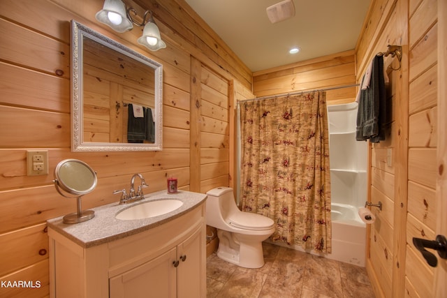 full bathroom featuring wood walls, vanity, and shower / bath combination with curtain