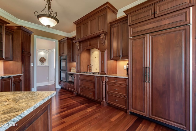 kitchen featuring dark wood-type flooring, decorative light fixtures, double oven, and paneled refrigerator