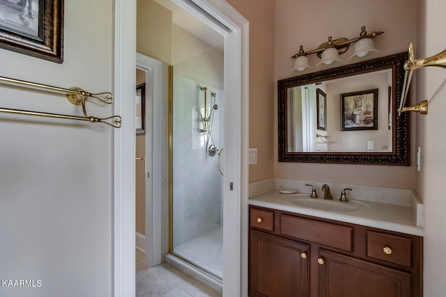 bathroom with a shower with shower door, tile floors, and vanity