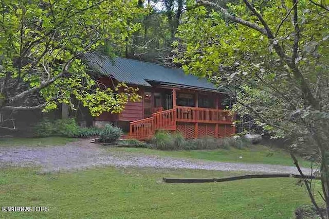 exterior space featuring a yard and a deck