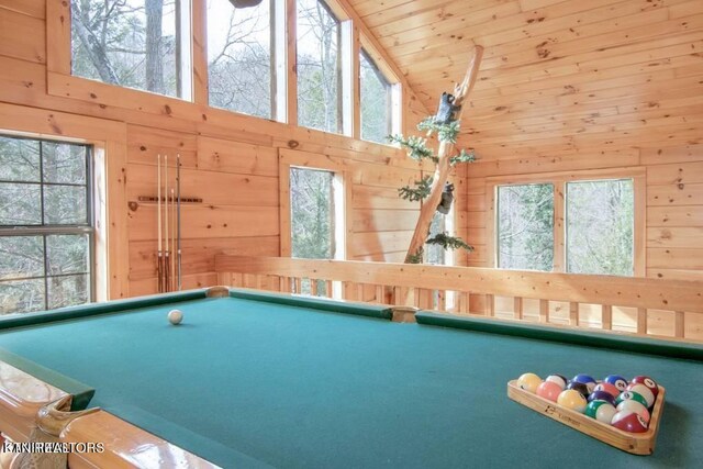 game room with wooden walls, high vaulted ceiling, billiards, and plenty of natural light