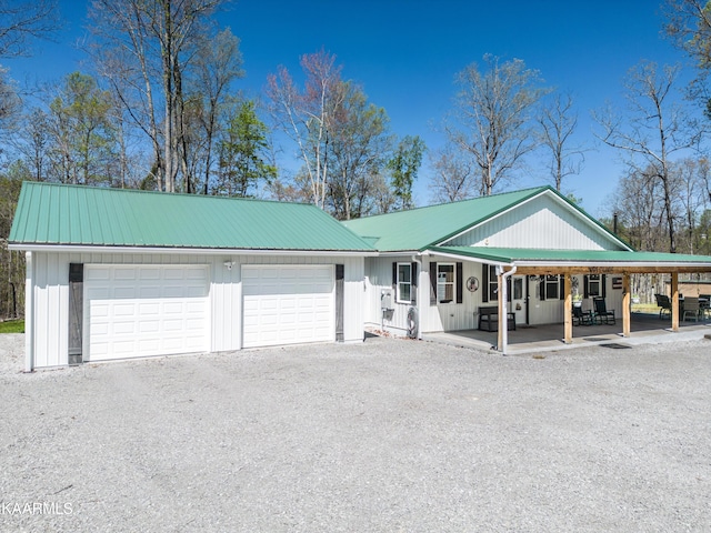 ranch-style home featuring a porch and a garage