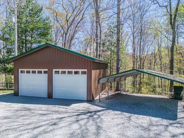 garage featuring a carport