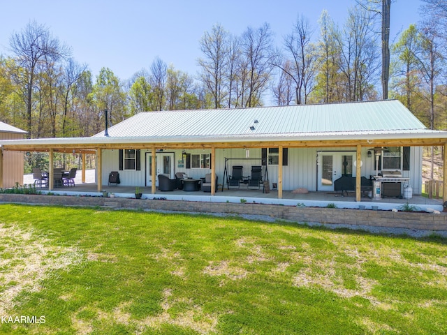 back of property featuring a yard, outdoor lounge area, and a patio