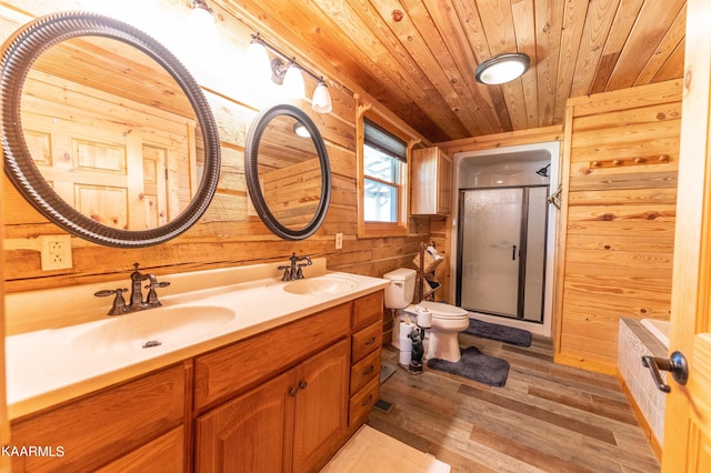 bathroom with toilet, wood walls, wood ceiling, hardwood / wood-style floors, and dual bowl vanity