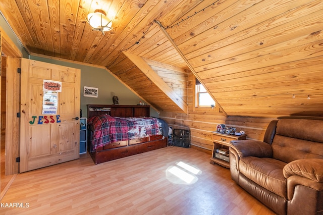 bedroom featuring wooden ceiling, vaulted ceiling with skylight, light wood-type flooring, and wooden walls