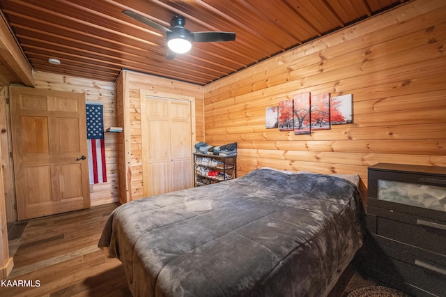 bedroom featuring wooden ceiling, ceiling fan, and dark hardwood / wood-style floors