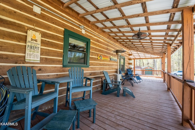 wooden terrace featuring ceiling fan