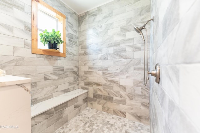 bathroom with a tile shower