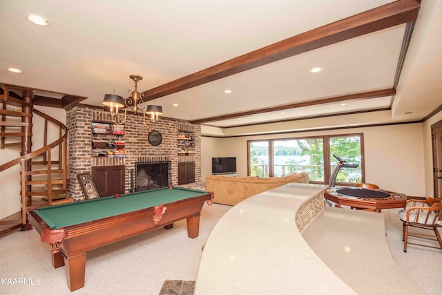 recreation room with carpet floors, a fireplace, billiards, ornamental molding, and beam ceiling