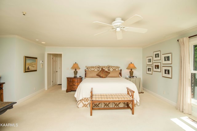 bedroom with light carpet, ceiling fan, and crown molding