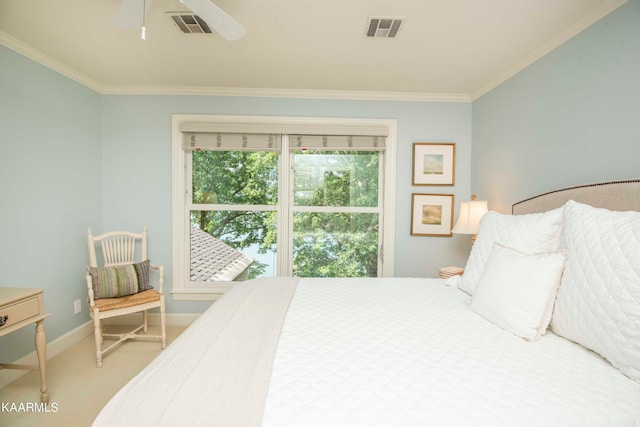 bedroom with ceiling fan, ornamental molding, and carpet floors