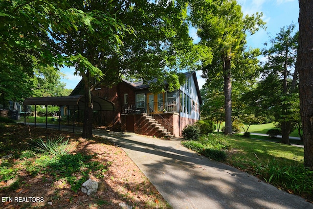 view of side of property featuring a carport