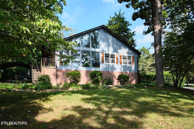 view of side of property with a yard