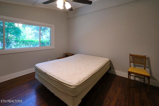 bedroom featuring dark hardwood / wood-style flooring and ceiling fan