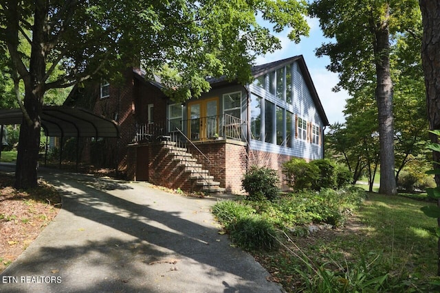 view of property exterior featuring a carport