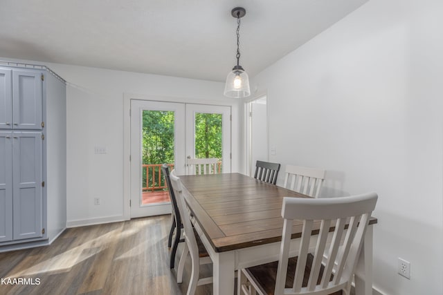 dining space with hardwood / wood-style floors