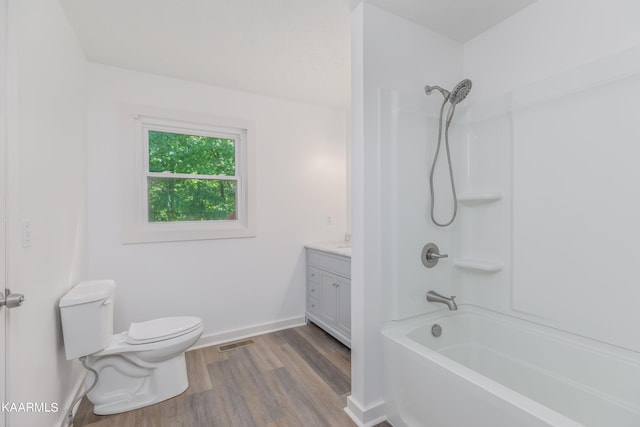 full bathroom with shower / bath combination, toilet, vanity, and wood-type flooring