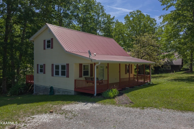 view of front of house featuring a front yard and covered porch