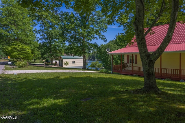 view of yard with covered porch