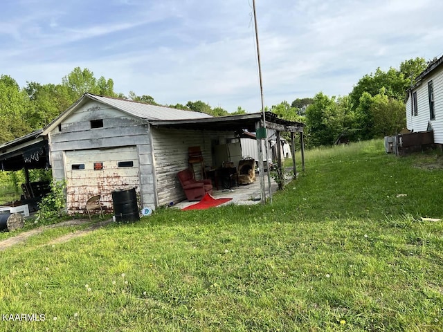 garage featuring a yard