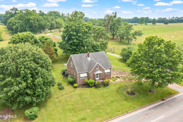 birds eye view of property with a rural view