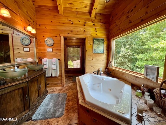 bathroom with vaulted ceiling with beams, wooden walls, wood ceiling, tile patterned floors, and dual bowl vanity