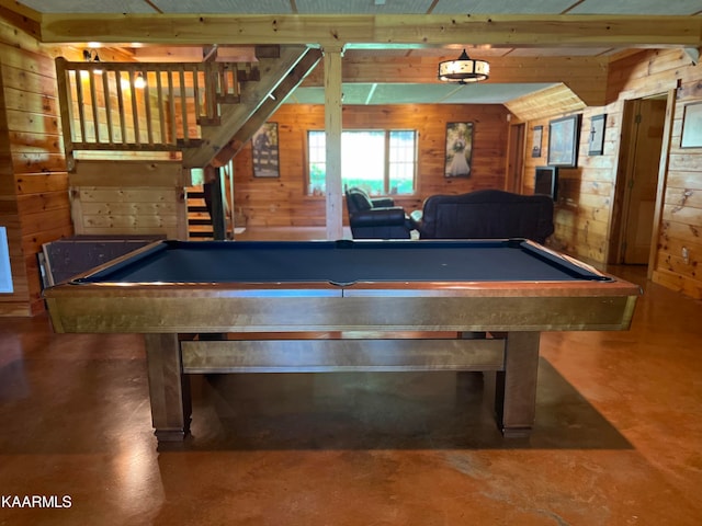 game room with wooden walls and pool table