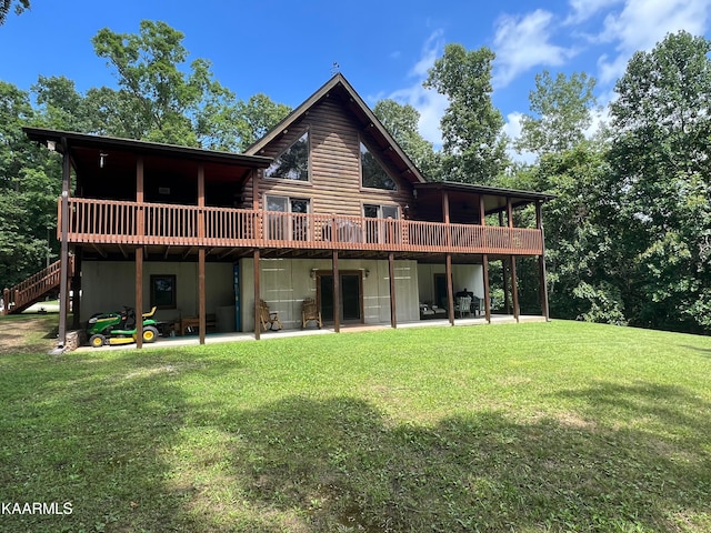 back of house featuring a deck and a yard