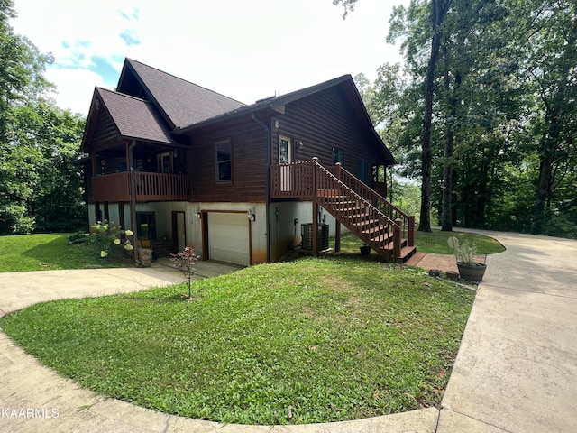 view of property exterior featuring cooling unit, a garage, and a lawn