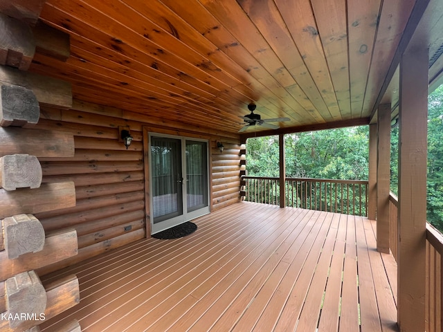 wooden terrace featuring french doors and ceiling fan